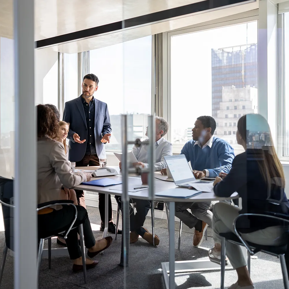 People sitting at a table in an office meeting room